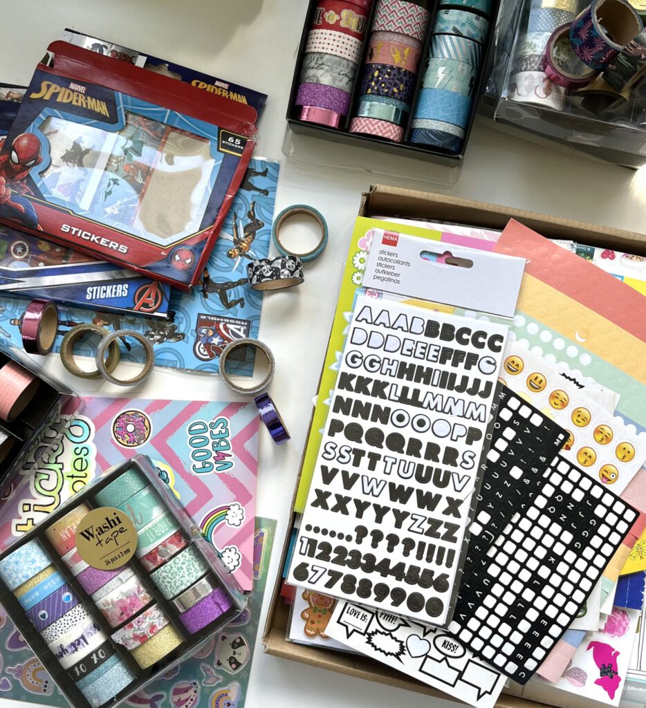 A big pile of all sorts of stickers: marvel themed, alphabet, emoji's, animals etc. And lots of washi tapes in all patterns and colors.